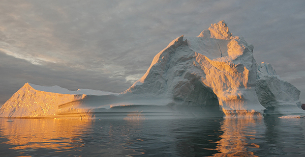An iceberg floats in Disko Bay, near Ilulissat, Greenland, on July 24, 2015. The massive Greenland ice sheet is shedding about 300 gigatons of ice a year into the ocean, making it the single largest source of sea-level rise from melting ice. ©NASA/Saskia Madlener, flickr