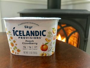Icelandic skyr with fireplace behind it.