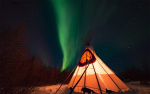 Northern lights illuminate teepee in Churchill