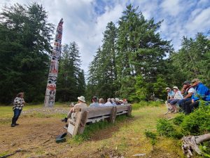 Gwaii Haanas Legacy Pole in Windy Bay. Haida Guardian Watchman and Carver Reg Wesley shares stories with my group.