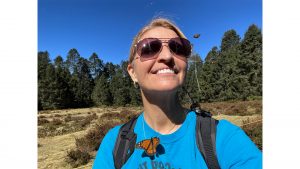 female woman traveler monarch butterfly migration conservation education Mexico