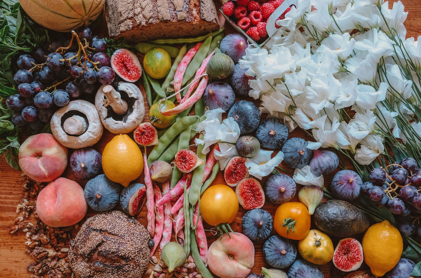 A tablescape of Tuscan fruits, vegetables and grains. 