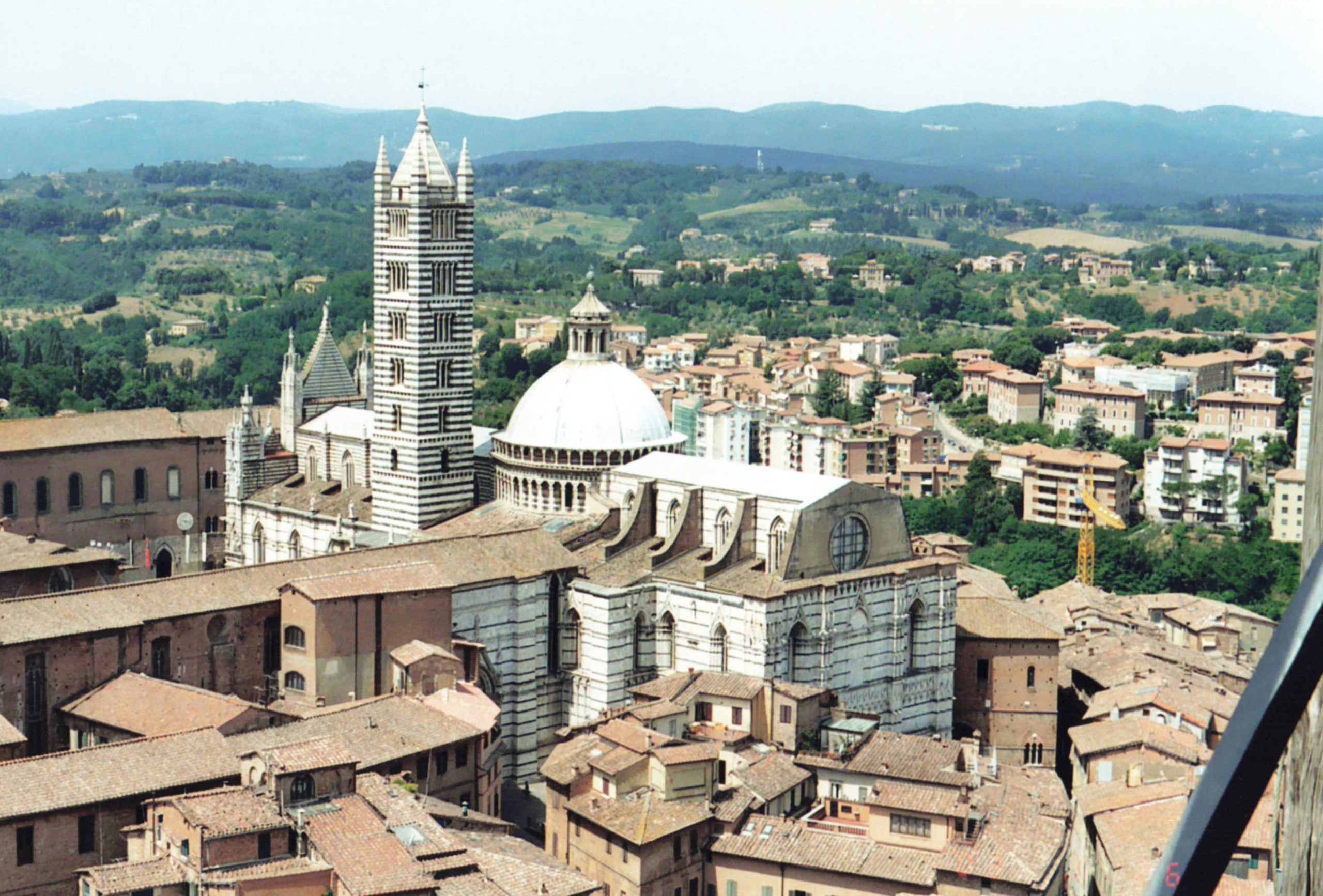 Siena Cathedral rising above medieval houses.